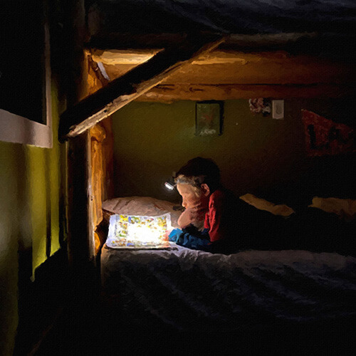 Kid on a perfect mattress reading a book and relaxing